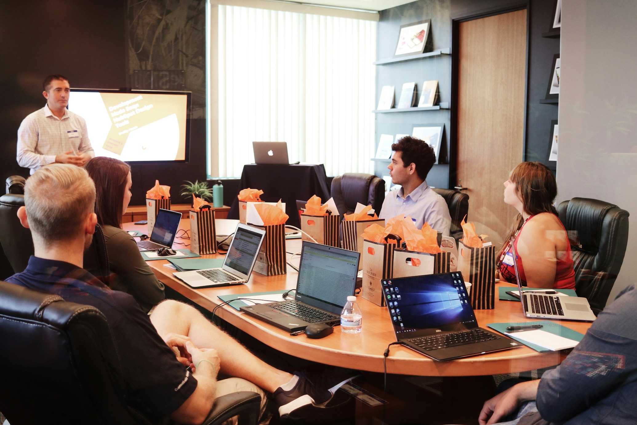 Professionals in a corporate event management or boardroom setting